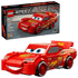 LEGO Speed Champions Lightning McQueen building set shown with its retail box and the assembled red toy car on a clean white background.