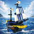 Toy pirate ship model on water with a scenic background
