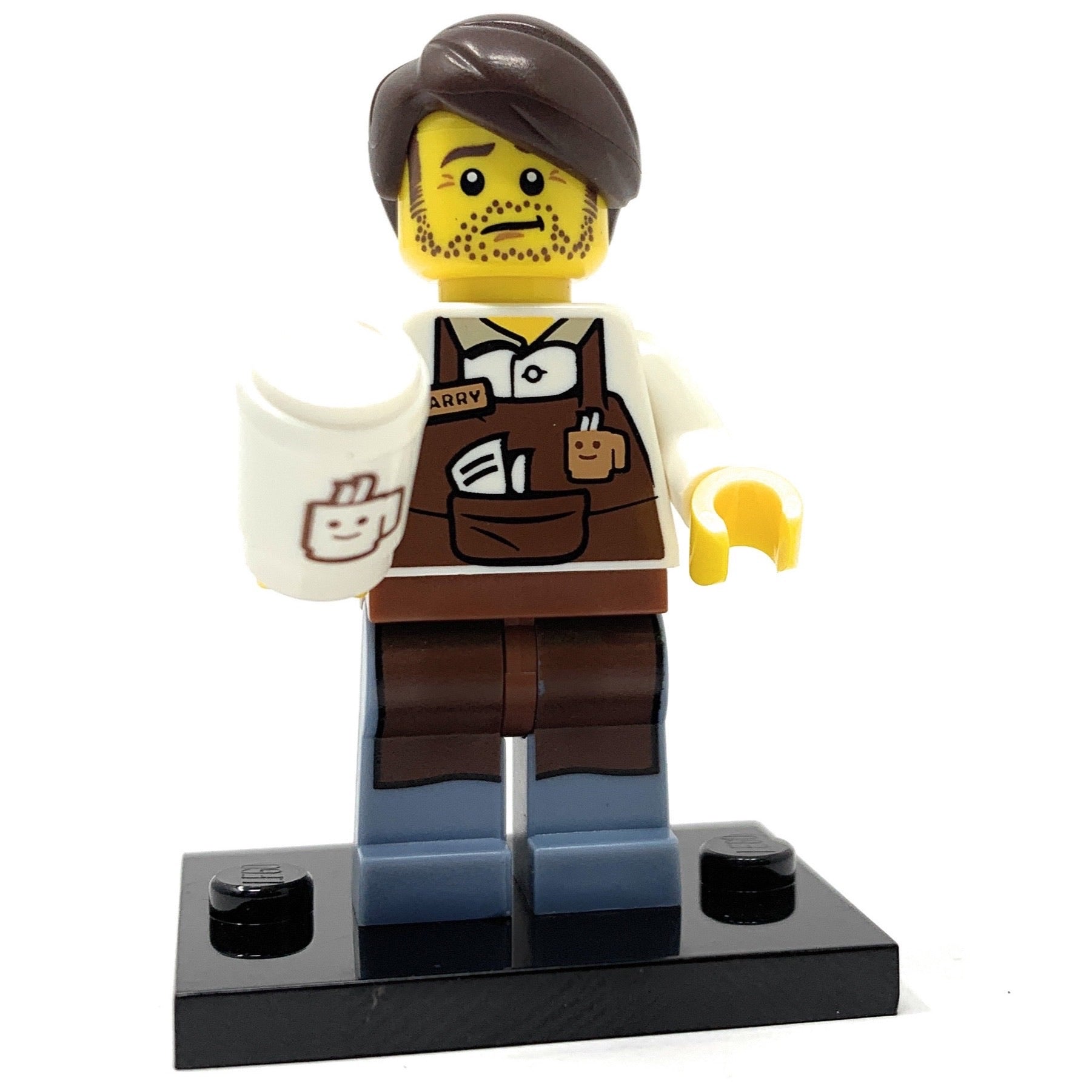 LEGO minifigure barista with a brown outfit and yellow hair on a white background